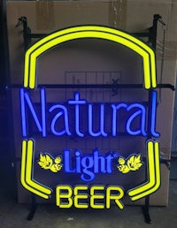 a neon sign that says natural light beer