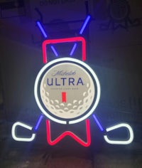 a neon sign with a golf ball and a golf club